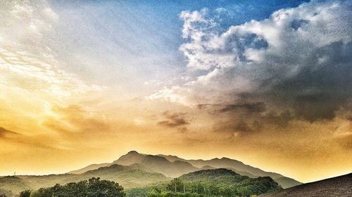 Scenic view of mountains against sky during sunset