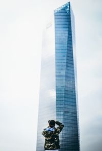 Low angle view of man against sky