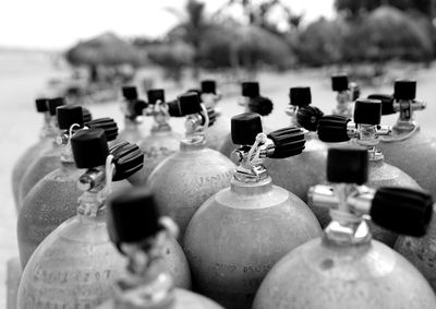 Close-up of aqualungs at beach