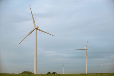 Low angle view of windmill against sky