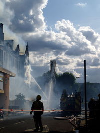 Water being sprayed on building during fire