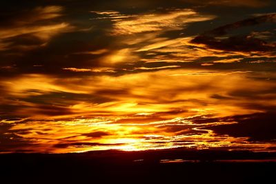 Scenic view of dramatic sky during sunset