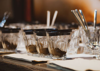 Close-up of wine glasses on table