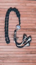 High angle view of shoes hanging on wooden table