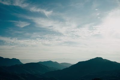 Scenic view of silhouette mountains against sky