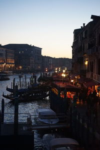 View of buildings in city at sunset