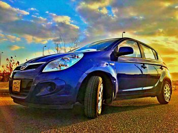 Close-up of car against blue sky