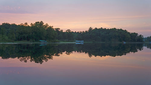 Scenic view of lake against sky at sunset