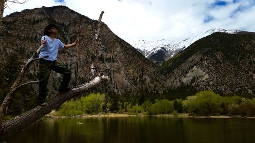 Full length of man on water against sky