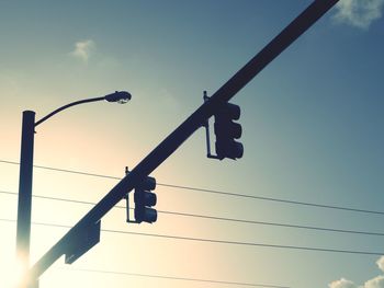 Low angle view of street light against sky