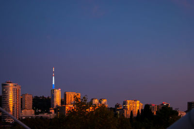 View of buildings against blue sky