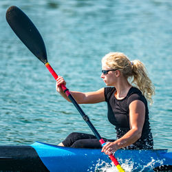 Woman kayaking in lake