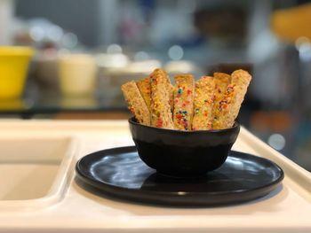 Close-up of snacks in bowl on table