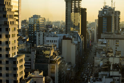 High angle view of buildings in city against sky