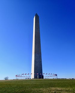 Low angle view of monument against clear blue sky