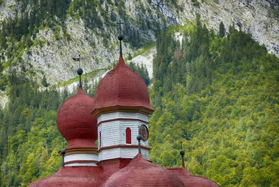 High section of st bartholomew church against mountain