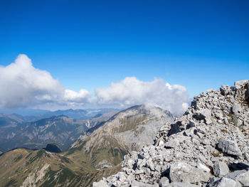 Scenic view of mountains against cloudy sky