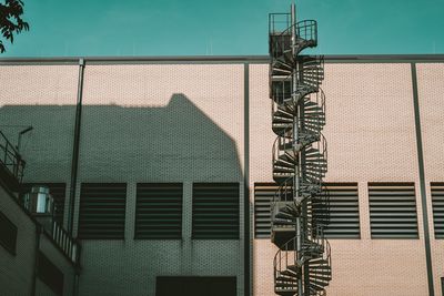 Metal grate of building against sky