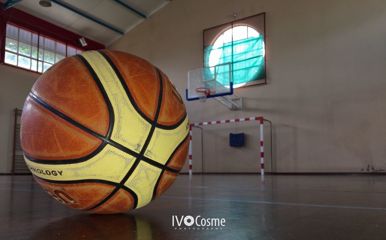 CLOSE-UP OF BASKETBALL HOOP IN THE COURT