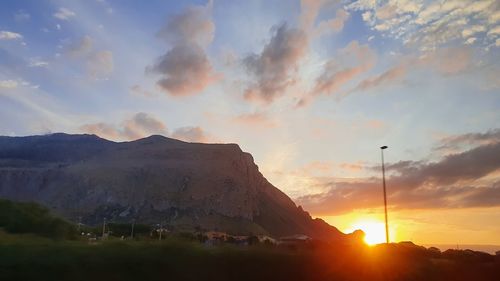 Scenic view of mountains against sky during sunset