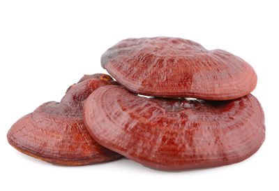 Close-up of strawberry over white background
