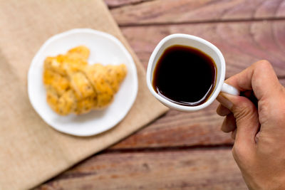 Directly above shot of coffee cup on table