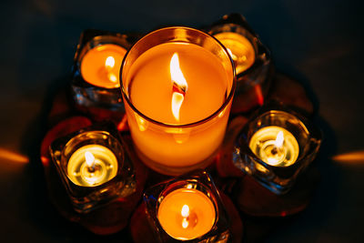 Close-up of illuminated tea light candles