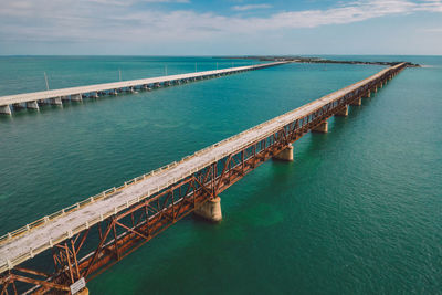 Pier over sea against sky