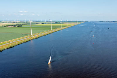 Aerial from sailing on the eenmeer with windmills in the netherlands
