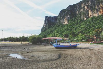 Scenic view of sea and mountains against sky