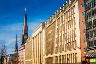 Tower of the st. james church and buildings at hamburg city center on a beautiful early spring day