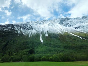 Scenic view of snowcapped mountains against sky