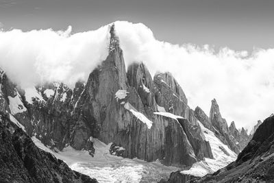 Panoramic view of snowcapped mountains against sky