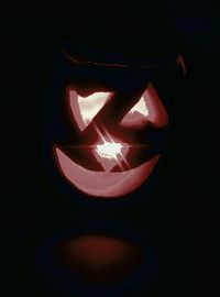 Close-up of illuminated light painting against black background