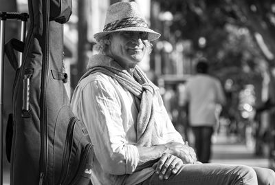 Portrait of man sitting outdoors