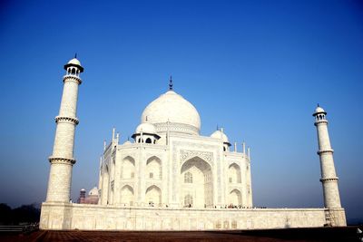 Taj mahal in city against sky