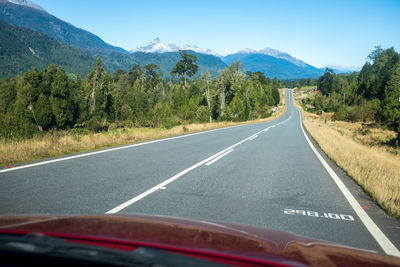 Empty road against mountain