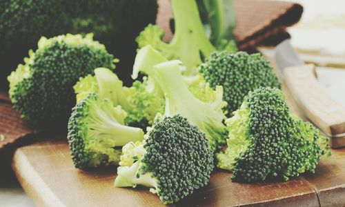 Close-up of broccoli on cutting board at home