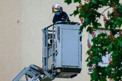 Low angle view of man working at construction site