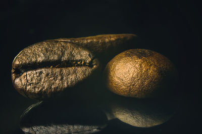 Close-up of oranges over black background