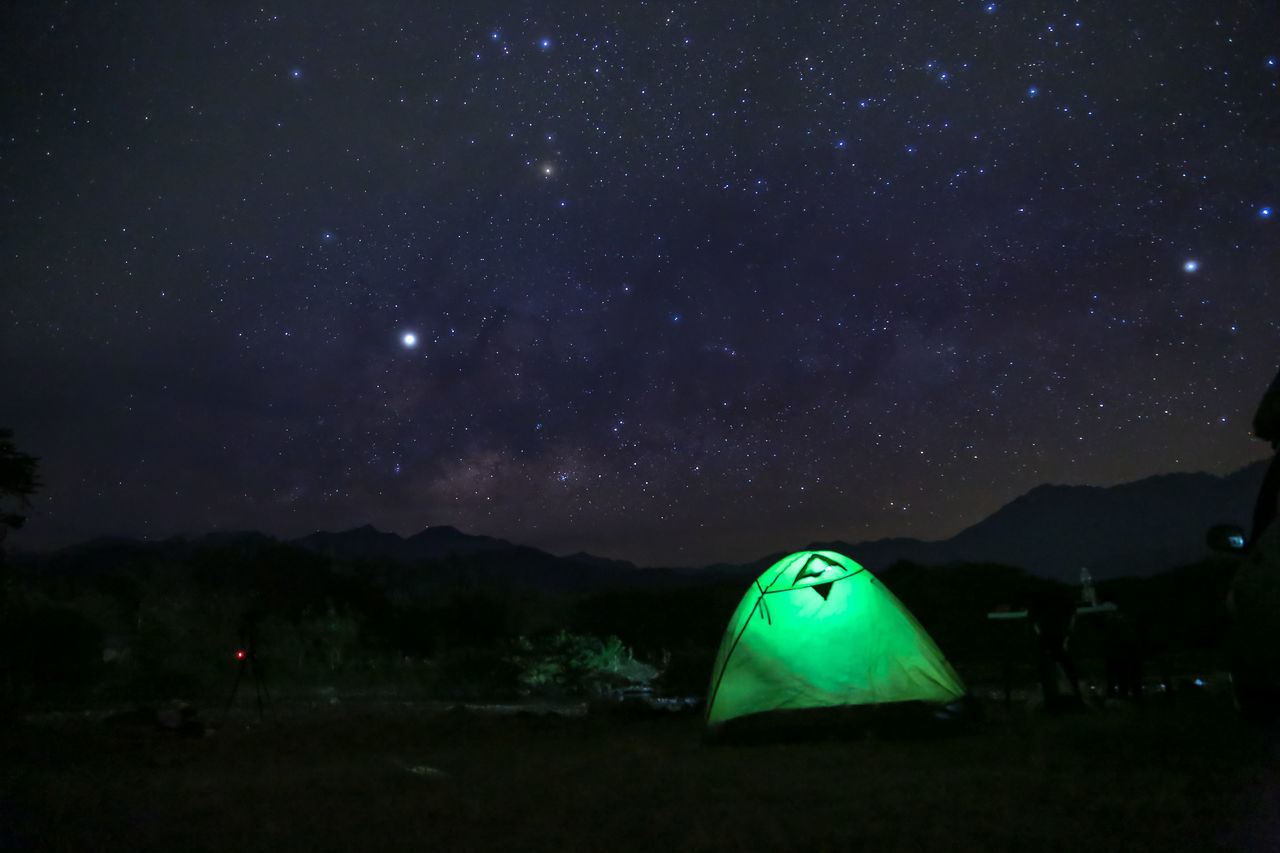 VIEW OF TENT AGAINST STAR FIELD