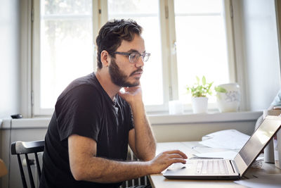 Young man using laptop