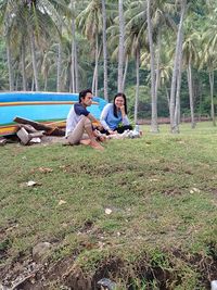 Young couple sitting on land