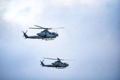 Low angle view of airplane in flight against sky