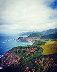 Scenic view of sea against cloudy sky