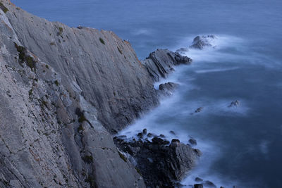 Scenic view of rock formation in sea