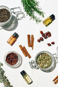 Variety of herbs and herbal mixtures on linen surface top view. alternative medicine.