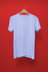 White decoration hanging against red background