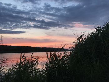 Scenic view of lake against sky during sunset