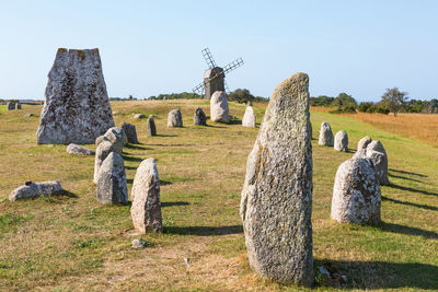 Stone ship on a grave field with a windmill